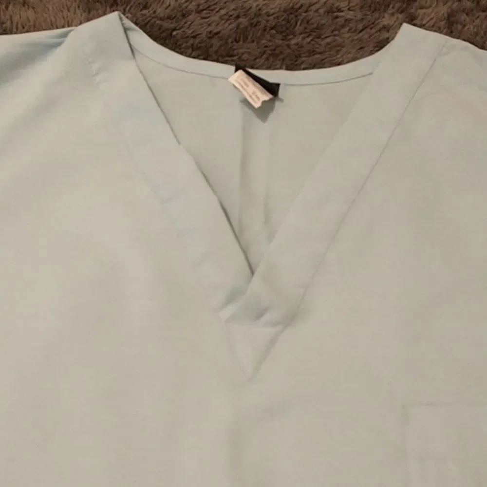 π3/$12 Light teal colored scrub top! - Picture 2 of 6